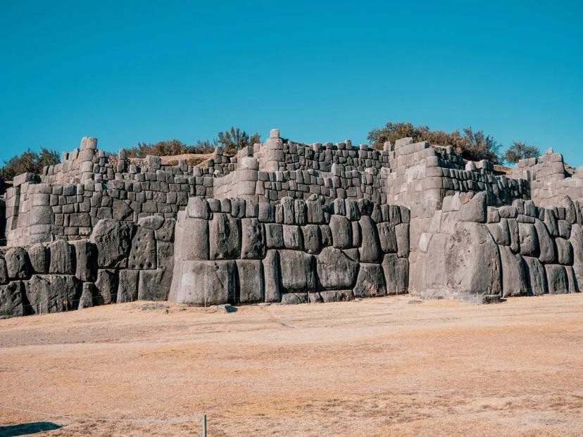   <p class="entry-thumb-caption">
    The spectacular Sacsayhuamán ruins.
    <a href="https://unsplash.com/photos/a-large-stone-wall-in-the-middle-of-a-desert-Aut2dVexvGg">
      Photo by Ruben Hanssen on Unsplash
    </a>
    .
  </p>