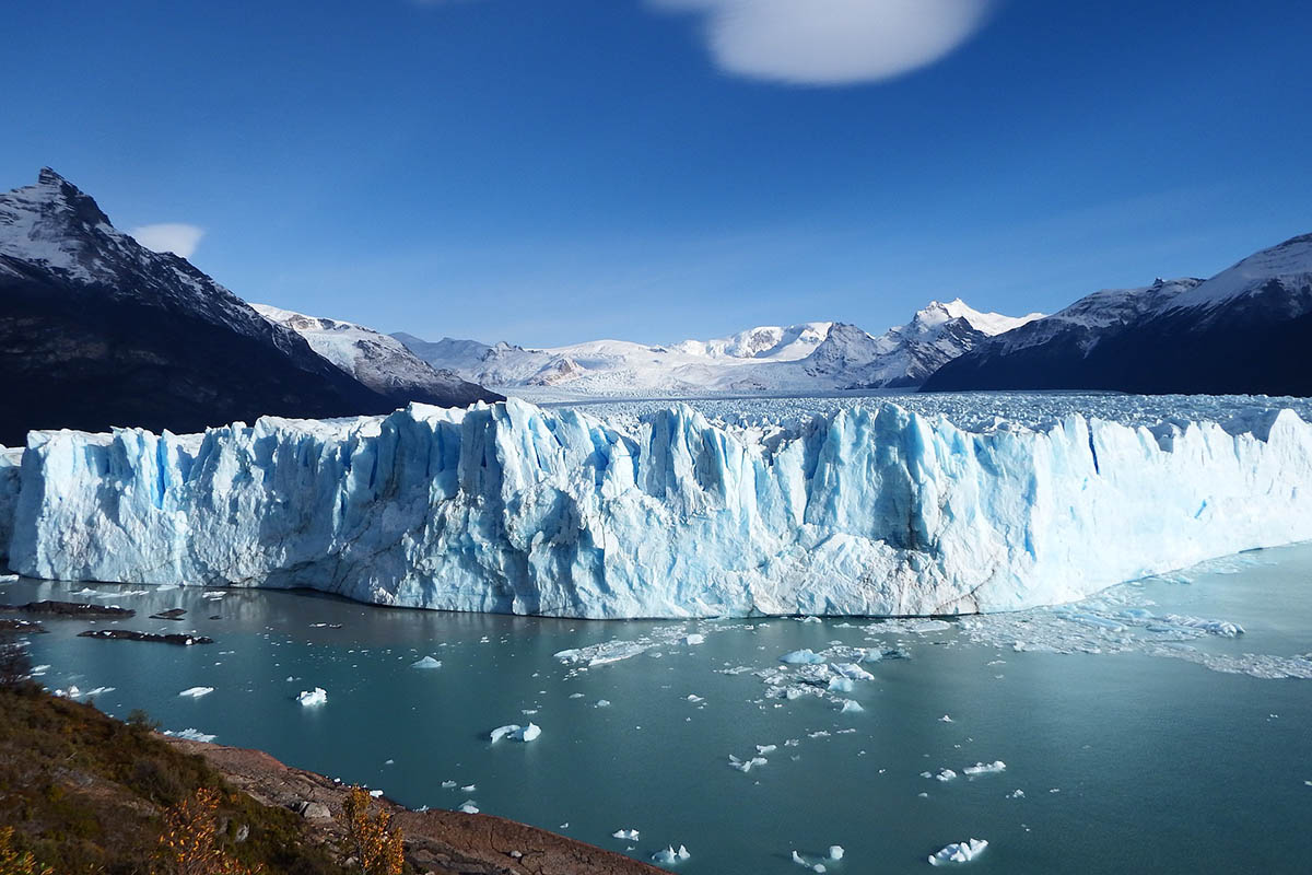 The glacial waters and snowcapped mountains surrounding the Perito Moreno Glacier in Argentina.