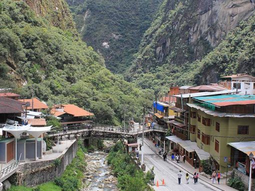 Hotels and stores in Aguas Calientes lining the river and street through town.