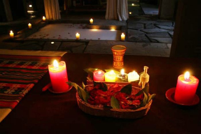 Candles lit at Inca Spa Cusco, a luxurious spa and wellness center.