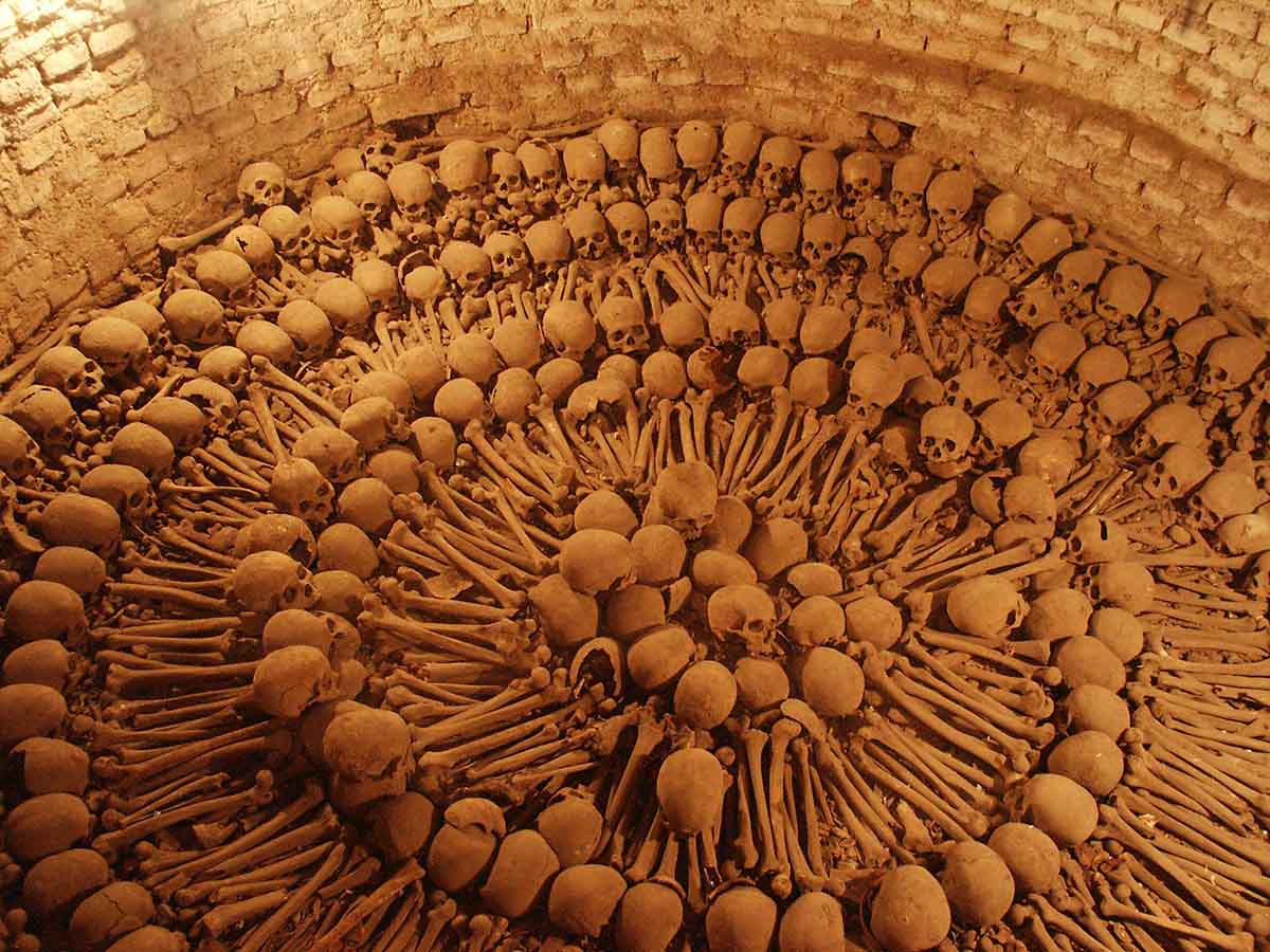 Femurs and skulls arranged in a circular pattern in the San Francisco Catacombs in Lima 