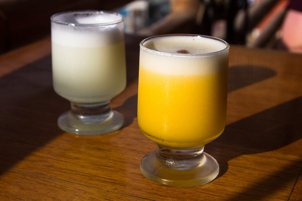 Yellow Peruvian passionfruit sour with white froth on top