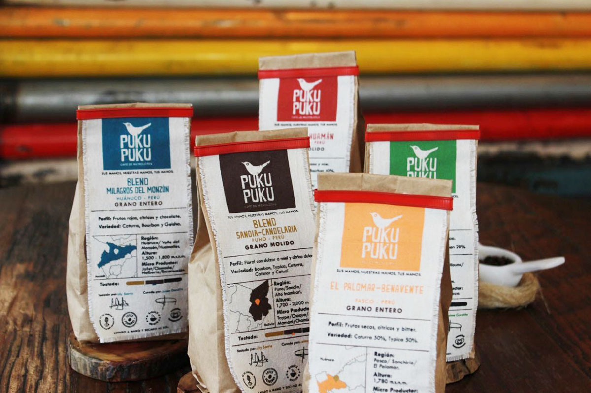 Four bags of Puku Puku organic coffee featuring different Peruvian coffee blends.