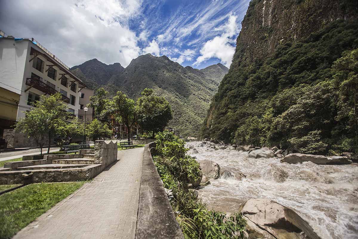 Riverfront walkway of Aguas Calientes with the roaring Urubamba River.
