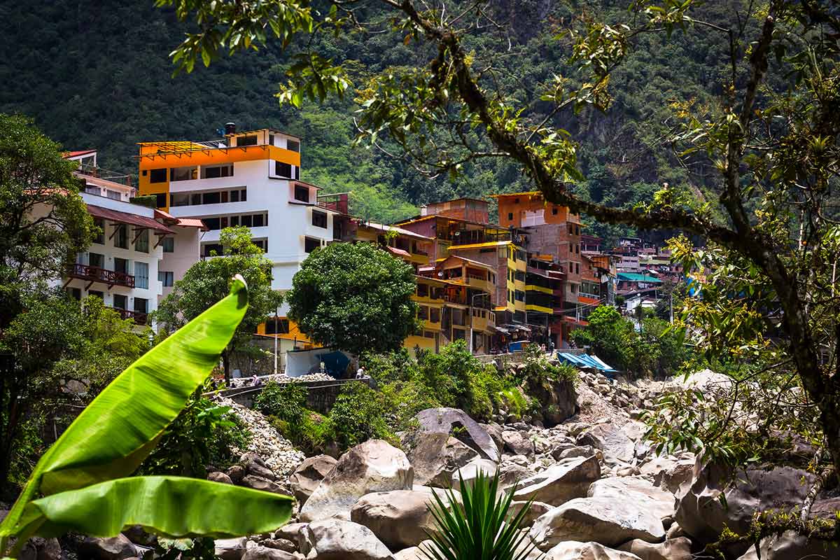 The Urubamba River rushing past the colorful buildings of Aguas Calientes (Machu Picchu Pueblo).