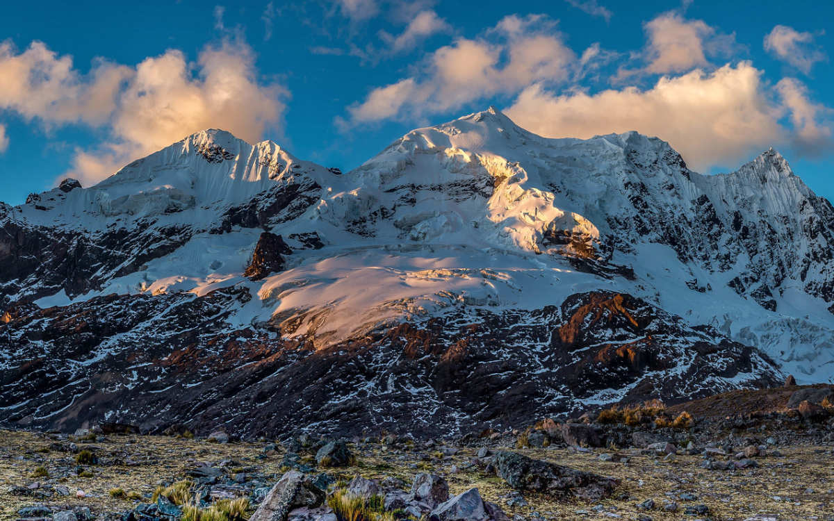 Blue skies and sacred Ausangate Mountain, which is the star of the 6-day Ausangate Trek in Peru.