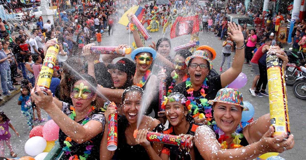 Group of festival goers with spray foam at Carnaval in Ecuador