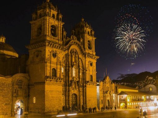 Cusco Plaza de Armas with a Firework in the night sky during the holiday season.