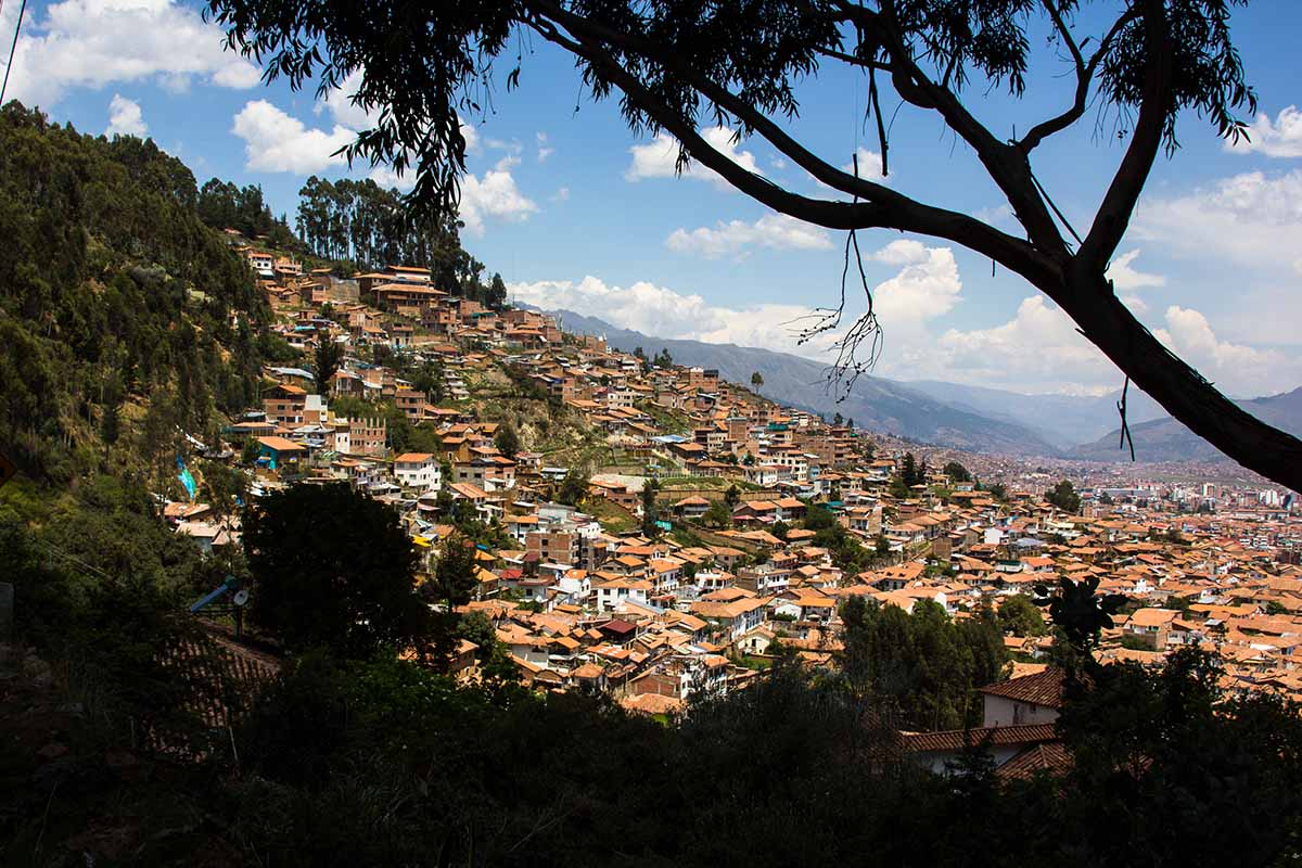 A view of the sprawling Cusco neighborhoods set into the mountains.