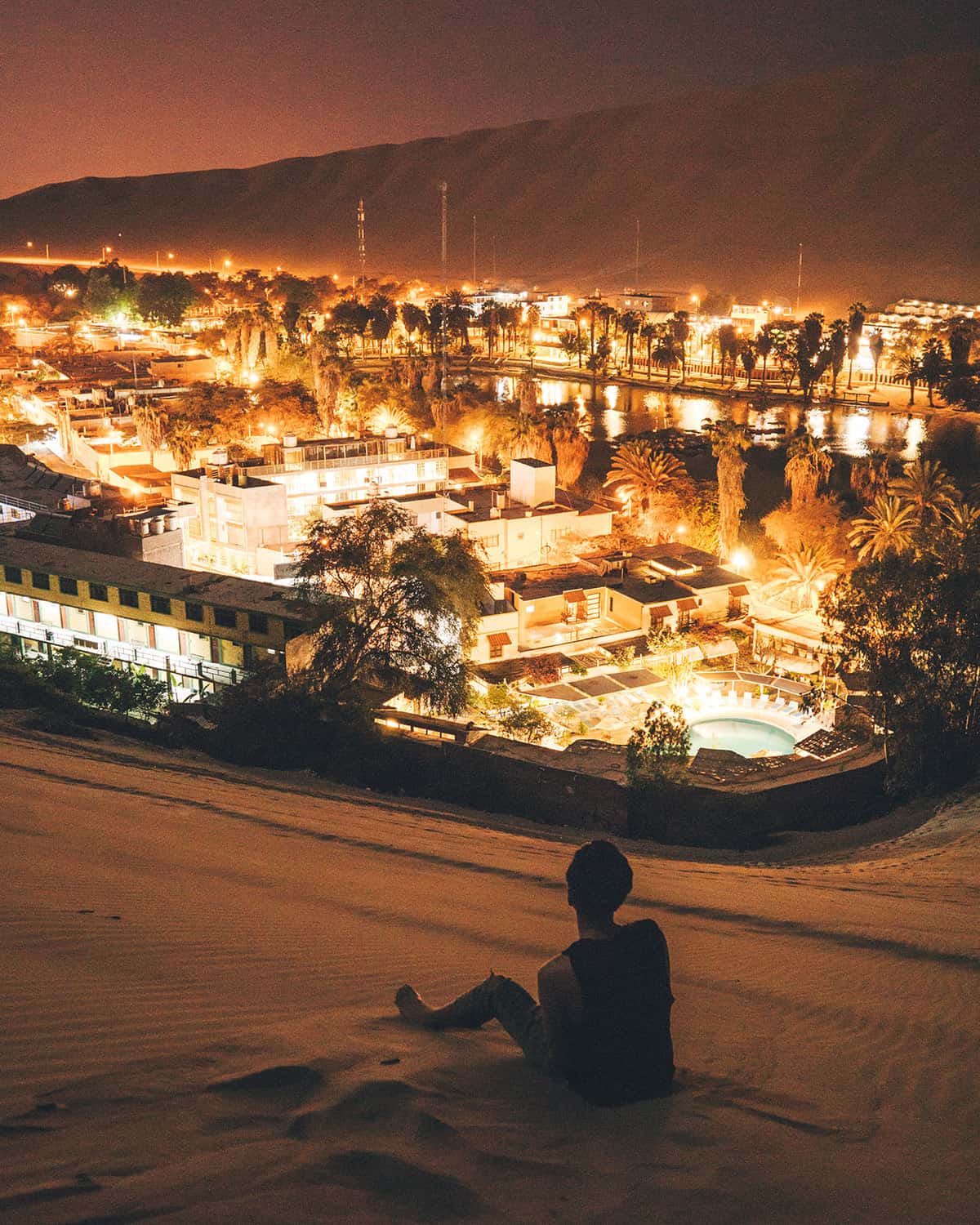 Bright lights of the Huacachina desert oasis at night