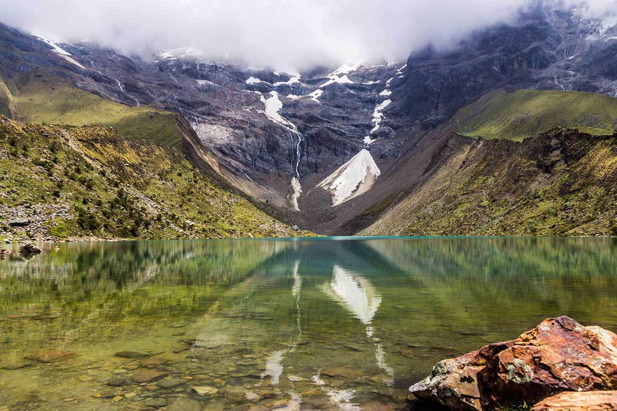 The deep blue-green Laguna Humantay, a glacial lake located high in the Andes Mountains near Cusco.