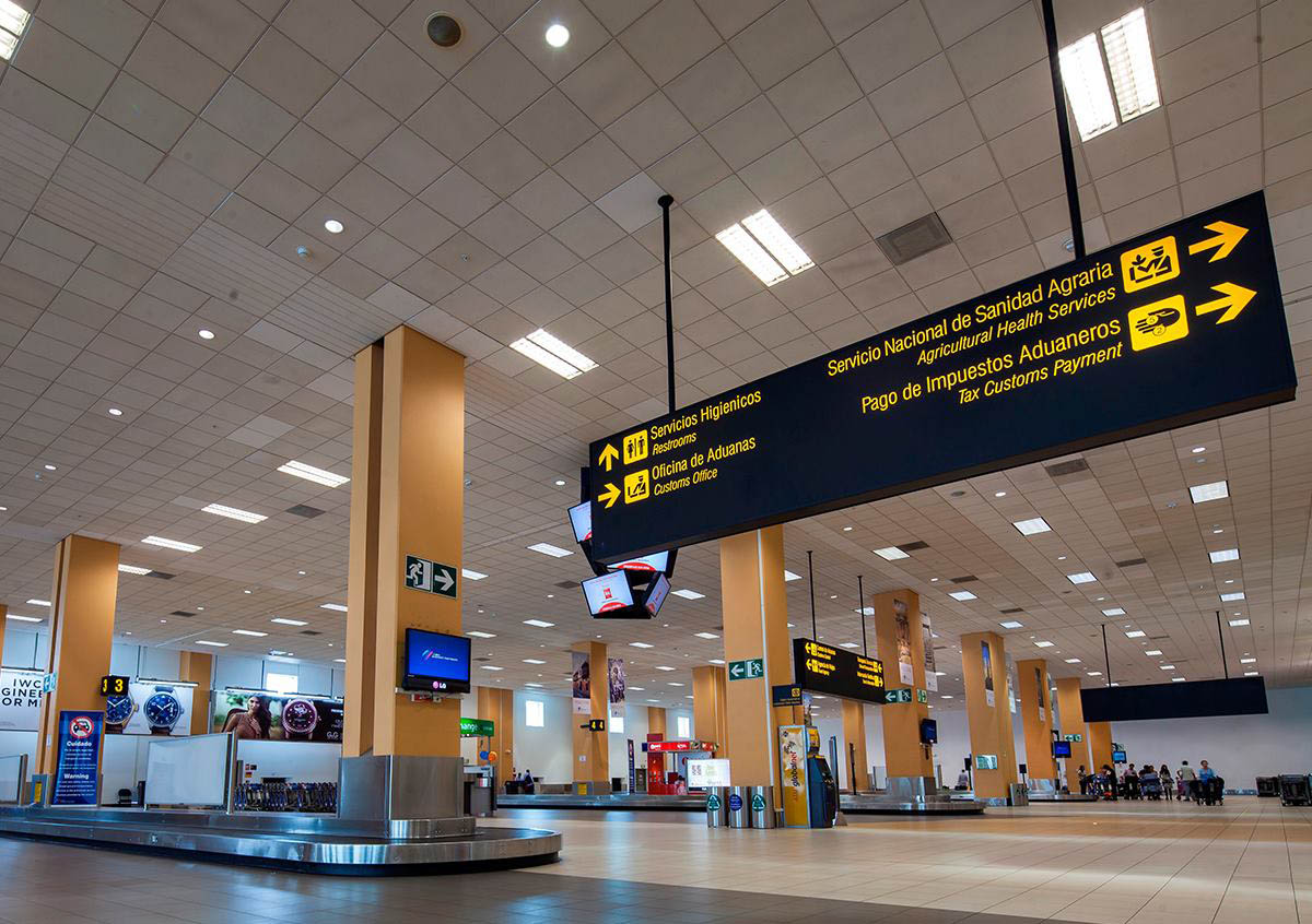 Nearly empty baggage claim hall at the Lima airport.