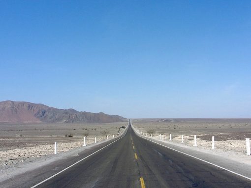 The open Pan American Highway going through the arid coast of Peru.