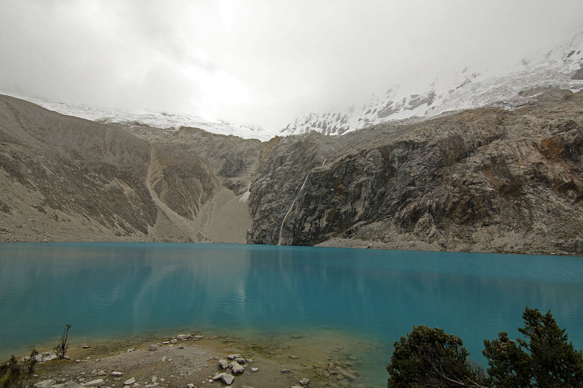 The water of Laguna 69 is a turquoise blue even on an overcast day. 