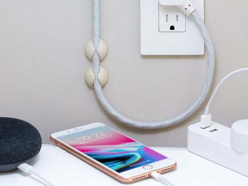 iPhone and other electrical devices plugged into electrical outlet