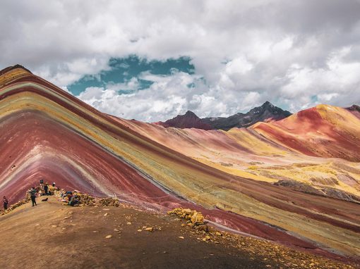 Panoramic view of the multi-colored Rainbow Mountain and the nearby Red Valley in Cusco.