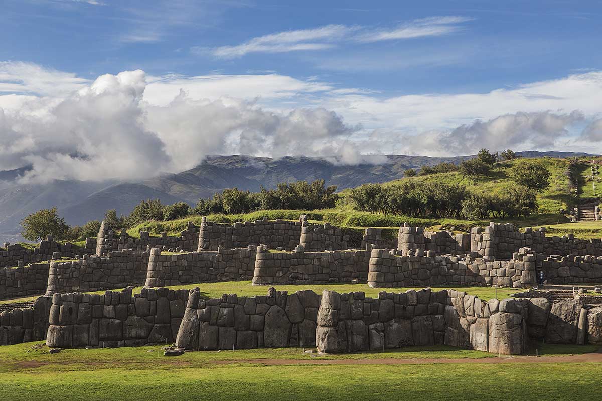 A sunny day view of the zig-zagging Inca walls of Sacsayhuaman.