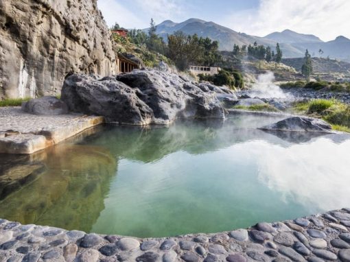 Hot springs nestled in a canyon landscape at Colca Lodge, one of the best spa resorts in Peru.