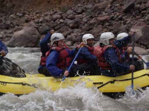 A group of adventurers white water rafting on the Urubamba River in the Sacred Valley.